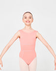 Female dancer wearing Giselle Dusty pink high neck ballet leotard