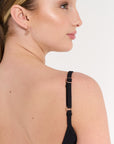 Close up of young woman wearing ribbed activewear black bodysuit