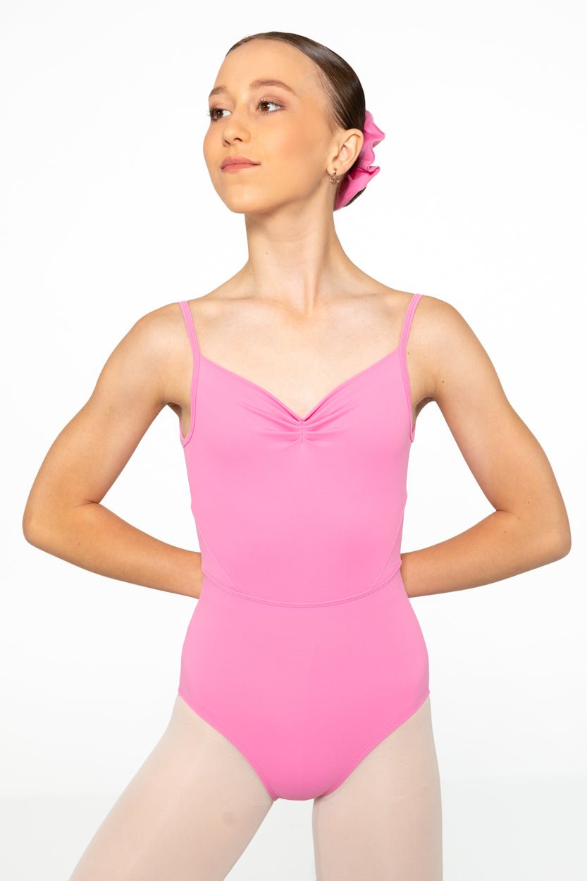 Female dancer wearing Odette Lolly mid pink adjustable strap ballet leotard
